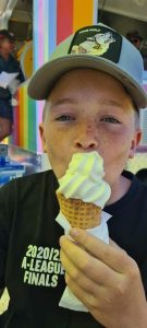 Young kid enjoying soft serve ice cream from Dreamtime Icecreamery ice cream van